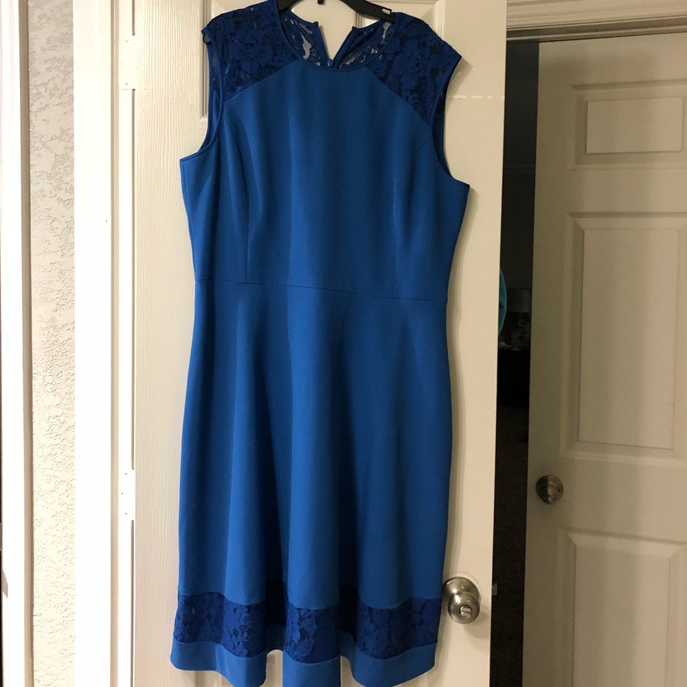 Blue dress with lace accents.